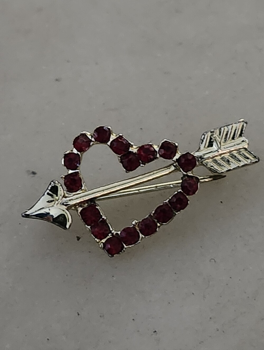 Gold Tone Open Heart Arrow Brooch with Red Rhinestone Accents